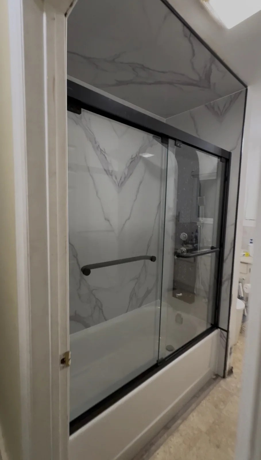 Tub surround and sliding glass shower door installation