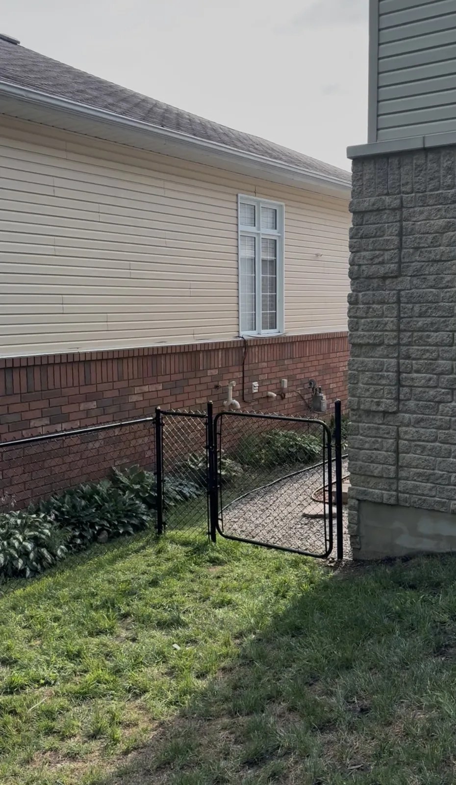 Black chain-link gate installation