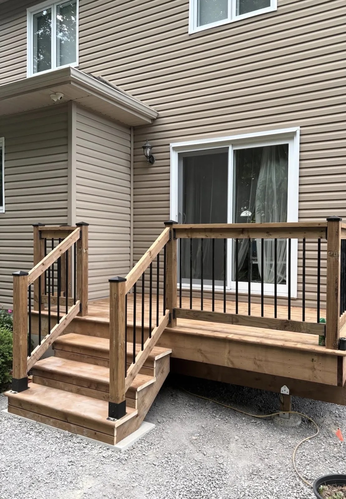 Wood deck and stair construction with railing