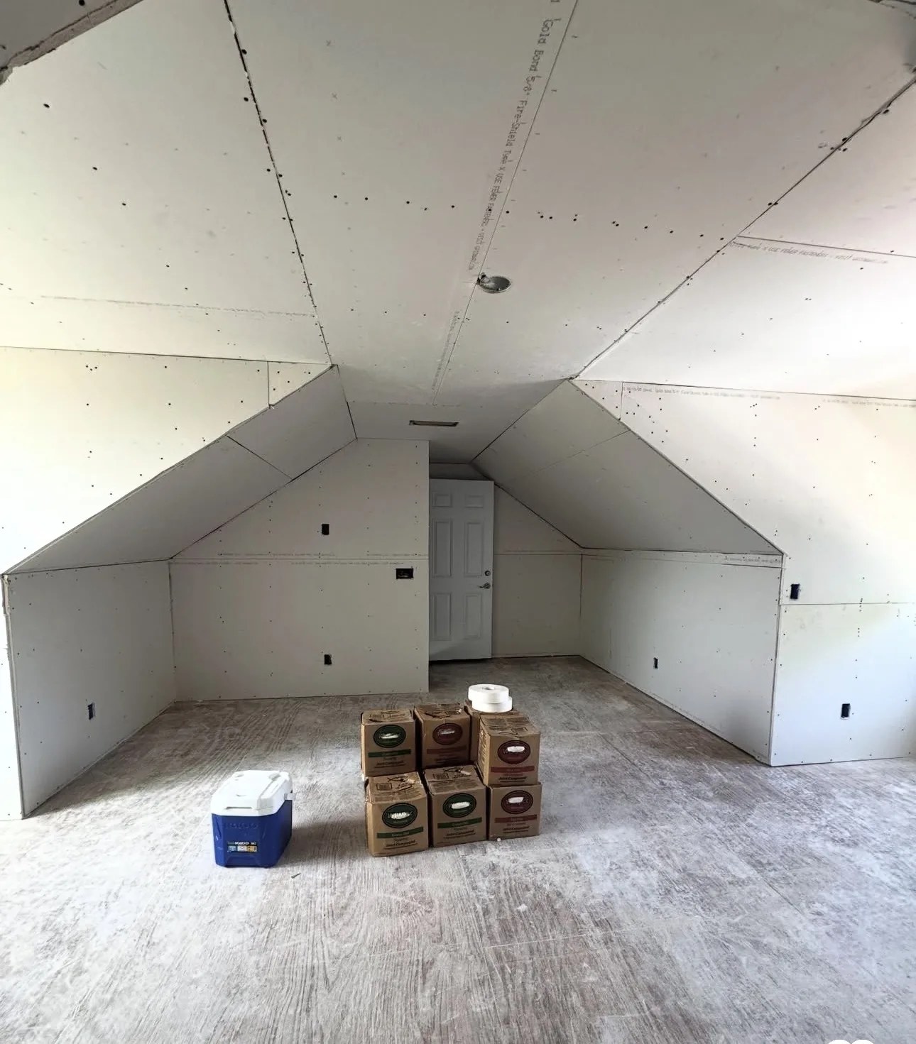 Drywall installation on walls and sloped ceiling